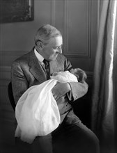 U.S. President Woodrow Wilson holding his Grandson Francis Bowes Sayre Jr, Photograph by Harris & Ewing, 1915