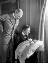 U.S. President Woodrow Wilson Standing over Son-in-law Francis Bowes Sayre Sr. as he is holding his son Francis Bowes Sayre Jr, Photograph by Harris & Ewing, 1915