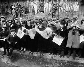 Group reading newspapers with News of Death of Former U.S. President Woodrow Wilson, Washington, D.C., USA, Harris & Ewing, February 1924