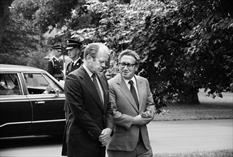 U.S. President Gerald Ford and Secretary of State Henry Kissinger, conversing, on the grounds of the White House, Washington, D.C., USA, photograph by Thomas J. O'Halloran, August 16, 1974