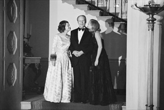 U.S. President Gerald Ford, First Lady Betty Ford, and daughter Susan Ford at a White House Christmas party, Washington, D.C., USA, photograph by Thomas J. O'Halloran,  December 1975