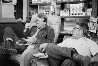 Democratic U.S. Presidential Nominee Jimmy Carter eats with his brother, Billy Carter, during a campaign stop at Billy's Gas Station, Plains, Georgia, USA, photograph by Thomas J. O'Halloran, Septembe...