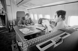 Democratic Presidential Nominee Jimmy Carter and his Chief Speechwriter, Pat Anderson, Working aboard the "Peanut One" Campaign Airplane, photograph by Thomas J. O'Halloran, September 13, 1976