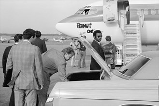 Democratic Presidential Nominee Jimmy Carter Retrieving his luggage from Car before Boarding "Peanut One" Campaign Airplane, photograph by Thomas J. O'Halloran, September 1976