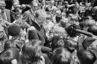 U.S. President Jimmy Carter surrounded by school children, North Carolina, USA, photograph by Thomas J. O'Halloran, April 29, 1977