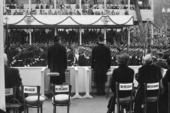 Rear View of U.S. President Dwight Eisenhower and U.S. Vice President Richard Nixon Reviewing Inauguration Parade, First Lady Mamie Eisenhower and Second Lady Pat Nixon seated right, Washington, D.C.,...