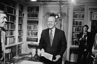 U.S. President Gerald Ford standing and smiling after giving a television speech at the White House, Washington, D.C., photograph by Marion S. Trikosko, January 13, 1975