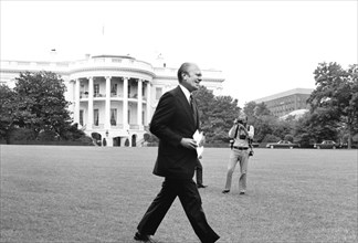 U.S. President Gerald Ford walking across the lawn to a press conference at the White House, Washington, D.C., USA, photograph by Marion S. Trikosko,