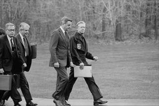 U.S. President Jimmy Carter, Vice President Walter Mondale, Secretary of State Cyrus Vance, and Secretary of Defense Harold Brown after disembarking from their helicopter to meet about Iran Hostage Cr...