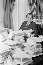 U.S. President Richard Nixon with Stacks of Telegrams after War Speech, White House, Washington, D.C., USA, photograph by Warren K. Leffler, November 4, 1969