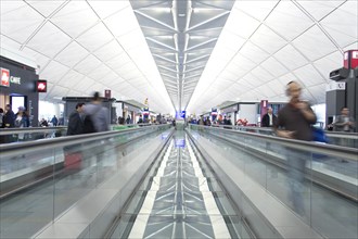 Travelers on Moving Walkway, Chek Lap Kok Airport, Hong Kong, China