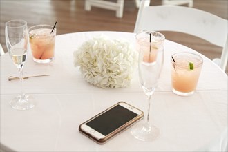 Cocktails and Phone on Wedding Reception Table