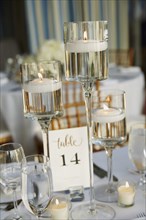 Candle Lights and Drinking Glasses on Wedding Reception Table