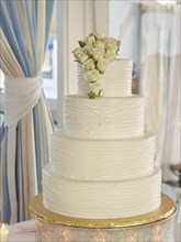 Multi-Tiered Wedding Cake with White Roses