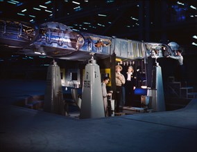 War Production Workers working on Wing of Consolidated Liberator Bomber