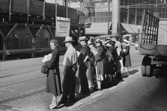 Group of People waiting for Street Car