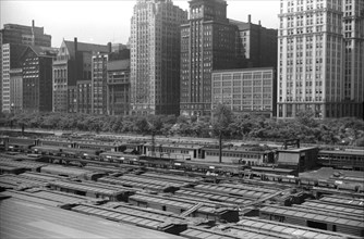 Freight Cars in Rail Yards with Cityscape in Background