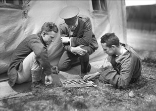 American Red Cross Man refereeing a Game of Checkers played by two Patients in the American Military Hospital No. 5
