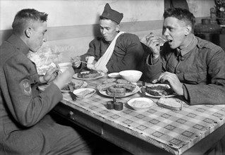 American Soldiers eating at American Red Cross Canteen