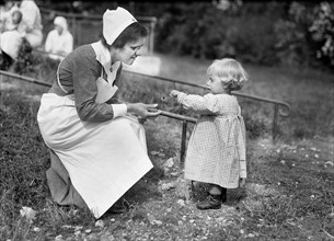 Young French Girl giving Flower to Nurse at American Red Cross Nursing Home