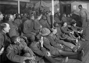 American Soldier entertaining Group of American Soldiers