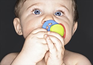 Close-up of Baby Boy Sucking on Pacifier