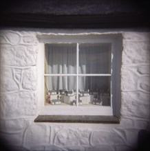 Miniature Models of First and Last House in Window Display