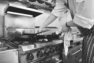 Chef Cooking on Restaurant Stove