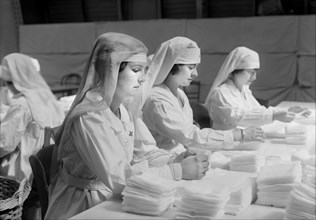 Folding Gauze Sponges in the American Red Cross Workrooms for making Surgical Dressings