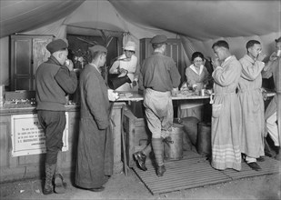 American Soldiers en route to the front being served daily with Coffee and Doughnuts at the American Red Cross Canteen