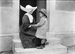 French Nun with young Child at Jeanne D'Arc Dispensary