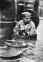 German Sailor coming out of Turret on Torpedo Boat