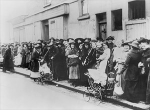 Women and Children waiting in Bread Line