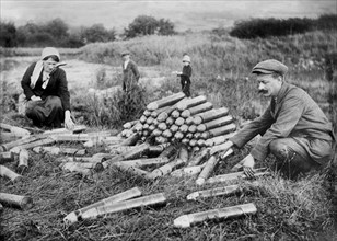 Man and Woman looking at Artillery Shells abandoned by German Troops after the First Battle of the Marne