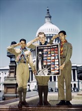 Portrait of Three Saluting Boy Scouts helping to Distribute The United Nations Fight for Freedom Posters to help War Effort