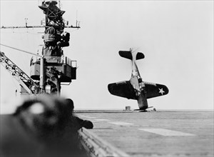 Douglas SBD "Dauntless" Dive Bomber balanced on Nose after crash landing on Carrier Flight Deck