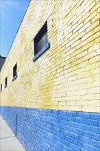 Brightly Colored Blue and Yellow Brick Building