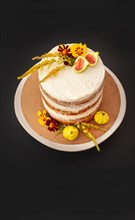 High Angle View of Vanilla Layer Cake Decorated with Edible Fresh Flowers and Fruit