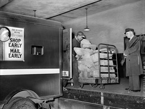 Workers on loading platform putting mail on Trucks, Main Post Office, 1938