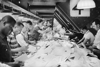 Workers sorting mail at Post Office, New York City, May 1957
