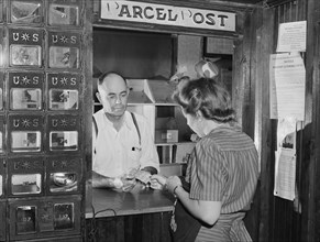 Woman buying Stamps in Post Office, Siren, July 1941
