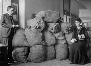 Supt. Marvin McLean and Mrs. Clara R.A. Nelson with Bags of Dead Letter Mail, U.S. Post Office, October 1916