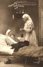Red Cross Nurse striking match to light Wounded Soldier's Cigarette, Postcard by Revanche,