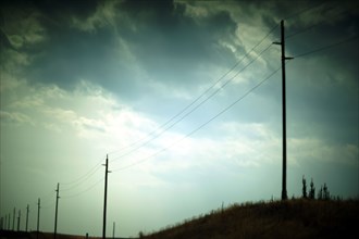 Roadside Utility Poles and Cloudy Sky, Atmospheric Mood,