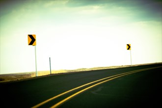 Directional Signs along curving Roadside ,,