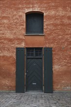 Black Doorway and Shutters against Rust Wall, Copenhagen,