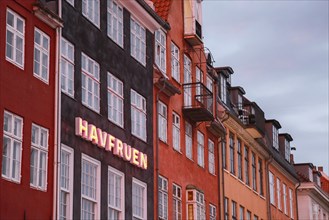 Havfruen Neon Sign on building at Sunset, Copenhagen,