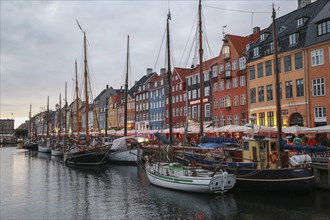 Sailboats along Nyhavn Canal at Sunset, Copenhagen,