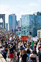 Crowd of Protesters with Signs Marching across Brooklyn Bridge during Juneteenth March, New York City,