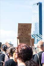 Crowd of Protesters with Signs Marching across Brooklyn Bridge during Juneteenth March, New York City,